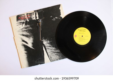 Miami, FL, USA: March 15, 2021: English rock band, The Rolling Stones music album on vinyl record LP disc. Titled: Sticky Fingers album cover