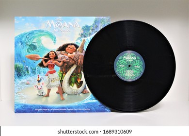 Miami, Fl, USA - March 30, 2020: Disney's Moana The Songs, LP Vinyl record standing on white background, Moana soundtrack