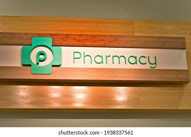 Miami, FL, USA - March 5, 2021: Publix Pharmacy Green Logo Sign In Interior Grocery Store Aisle As Coronavirus (COVID-19) Vaccines And Testing Facilities Open In Miami, Florida