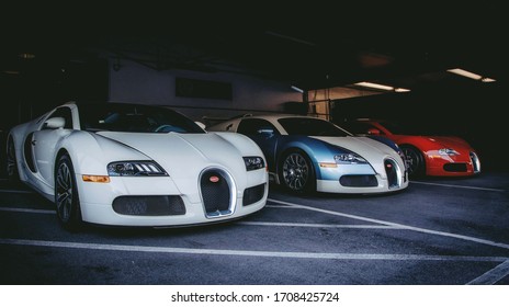 
Miami, FL. Year 2017: Three Bugatti Veyron parked in a luxury car store. Extreme high-performance supercars.
