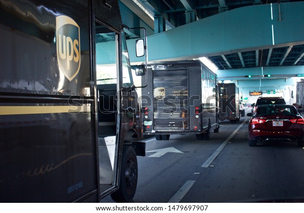 Miami Florida August 15,2019 UPS delivery\
trucks, called package cars, fan out from distribution center to\
deliver packages to\
customers