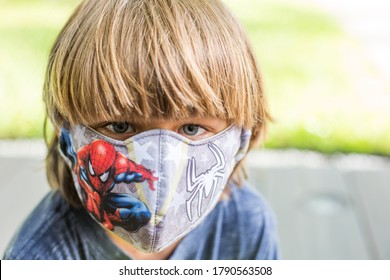 Miami, Florida - August 5, 2020: Child Wears Spiderman Cartoon Character Face Mask Cover On Hot Summer Day To Play Outside With Neighbors And Friends During Covid-19 Coronavirus Global Pandemic.