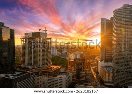Miami, Florida. Developing American megapolis with new high-rise buildings under construction at sunset