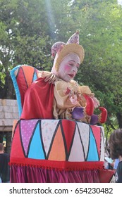 MIAMI, FLORIDA - MARCH 12, 2016: Knights battle at Renaissance Fair in authentic costumes, Renfair, Clown jester joker petrushka