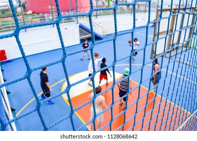 Miami, Florida - March 29 2014: Netting Around Basketball Court And A Game In Session, Onboard The Carnival Liberty Cruise Ship