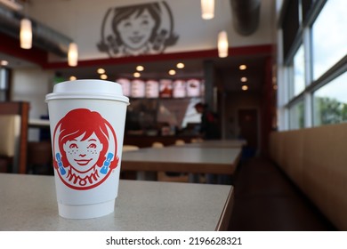 MIAMI, FLORIDA USA - 08-22-2022 
Isolated Drinking Cup At A Wendy's Restaurant. Out Of Focus Restaurant Interior In Background.