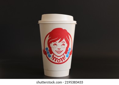 MIAMI, FLORIDA USA - 08-26-2022
Wendy's Drinking Cup With Lid Isolated Against Dark Background.