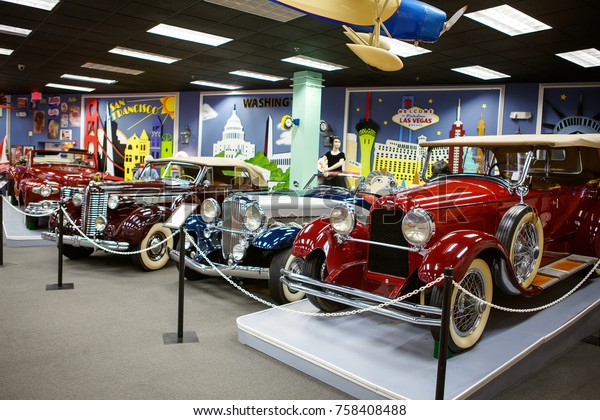 MIAMI, FLORIDA, USA -\
APRIL 11: Miami Auto Museum exhibits a collection of vintage and\
cinema automobiles, bicycles and motorcycles on April 11, 2016 in\
Miami, Florida, USA.