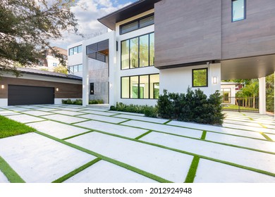 Miami, Florida, USA. August 27, 2019: Facade of a large modern mansion with large windows.