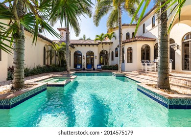 Miami, Florida, USA. December 20, 2020: Mansion With Spanish Architecture, A Large Pool And Palm Trees.