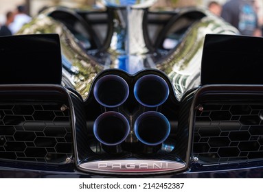 Miami, Florida USA - February 20, 2022: Close up view of the exhaust pipes of a exotic Italian Pagani Huayra Roadster supercar at the public Miami Concours car show in the upscale Design District.