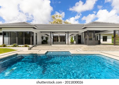 Miami, Florida, USA. January 3, 2021: Garden of a modern mansion in Miami with a swimming pool.