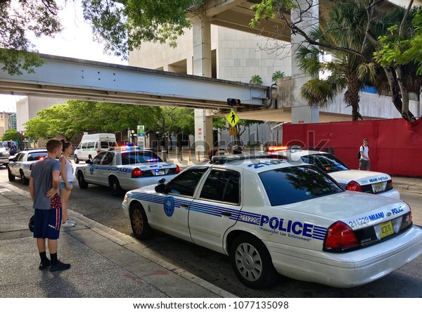 Miami, Florida, USA - July 17, 2016: Police car\
on Miami streets. Police Department serving Miami-Dade County and\
has more than 3 thousand\
officers