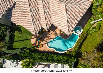 Miami, Florida, USA. July 27, 2021: Aerial View Of The Backyard Of A Luxurious House With A Swimming Pool.