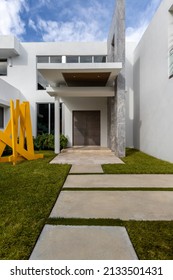 Miami, Florida, USA. November 16, 2021: Facade Of The Entrance To A American Dream House (mansion) With Art, A Big Door And Windows.