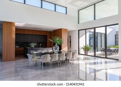 Miami, Florida, USA. October 1st, 2021: Lavish 12 Seater Dining Room, Backyard View And An Open Kitchen.