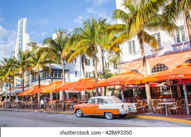 MIAMI, FLORIDA - View along Ocean Drive along South Beach Miami in the historic Art Deco District with hotels, restaurant and classic car