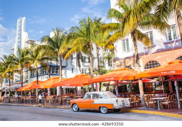 MIAMI, FLORIDA - View along Ocean Drive along South\
Beach Miami in the historic Art Deco District with hotels,\
restaurant and classic\
car