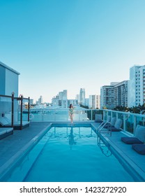 Miami, Florida/USA - March 01, 2019: A Girl On The Swimming Pool On The Rooftop Of The Hotel In Miami Beach