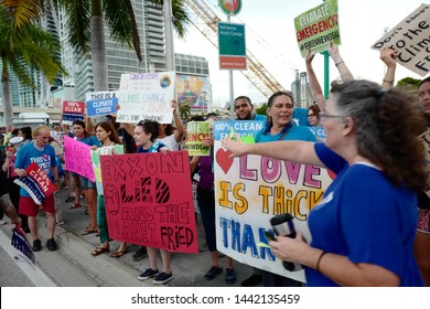 Miami, Florida/USA-June 26, 2019: A coalition of environmental groups, march & rallied outside the venue for the Democratic Presidential debate, with signs calling for specific climate change debates