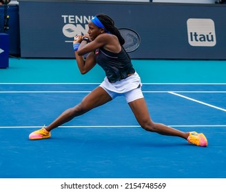 MIAMI GARDENS, FLORIDA - APRIL 1, 2022: Professional tennis player  Coco Gauff of USA in action during her semifinal women's doubles match at 2022 Miami Open at the Hard Rock Stadium in Miami Gardens