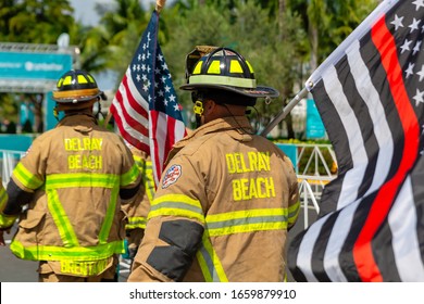 Miami Gardens, FloridaUSA - February 29, 2020: Firefighters From Delray Beach Fire Department With US National Flags Symbols At Dolphins Cancer Challenge At Hard Rock Stadium