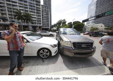 MIAMI - JULY 14: Car Accident On Brickell Boulevard And 5th Street Intersection At Brickell Miami July 14, 2015 In Miami FL USA. PErsons Involved In This Accident Are Standing By On The Phone. 