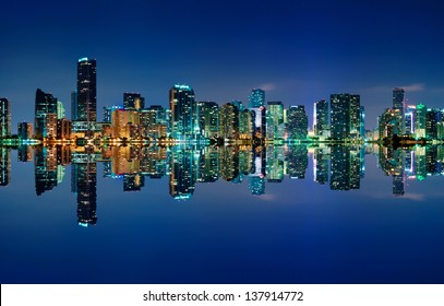 The Miami skyline at night with almost no clouds and nearly perfect reflections
