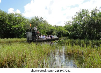 MIAMI, UNITED STATES - Mar 24, 2012: A Bright Summer Day With People Riding On The Swamp Boat Tour In The Florida Everglades