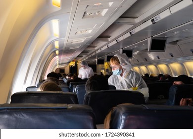 MIAMI, USA - APRIL 26, 2020: Covid 19 Coronaviruse. Stewardess In Protective Mask On The Plane Board. Evacuation Repatriation. Flying During Coronaviruse Pandemic. Special Flight Returns US Citizens