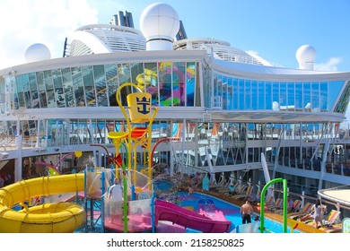 Miami, USA - April 29, 2022: People Having Fun At Pools, Bars, Entertainment And Innovative Activities At Symphony Of The Seas Is The Biggest Cruise Ship At Miami, USA On April 29, 2022