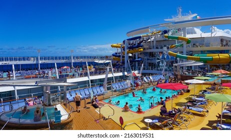 Miami, USA - April 29, 2022: People Having Fun At Pools, Bars, Entertainment And Innovative Activities At Symphony Of The Seas Is The Biggest Cruise Ship At Miami, USA On April 29, 2022