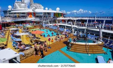 Miami, USA - April 29, 2022: People Having Fun At Pools, Bars, Entertainment And Innovative Activities At Symphony Of The Seas Is The Biggest Cruise Ship At Miami, USA On April 29, 2022