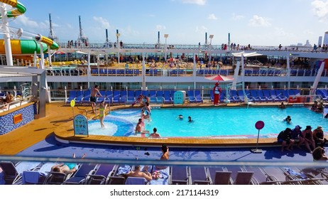 Miami, USA - April 29, 2022: People Having Fun At Pools, Bars, Entertainment And Innovative Activities At Symphony Of The Seas Is The Biggest Cruise Ship At Miami, USA On April 29, 2022