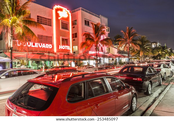 MIAMI, USA AUG 3, 2013: Night view\
at Ocean drive in Miami, USA. Art Deco Night-Life in South Beach at\
ocean drive is one of the main tourist attractions in\
Miami.