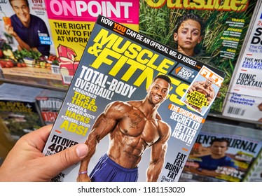 MIAMI, USA - AUGUST 22, 2018: Magazine In A Hand. Muscle And Fitness Is An American Fitness And Bodybuilding Magazine Founded By Joe Weider.