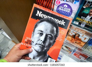 MIAMI, USA - AUGUST 23, 2018: Newsweek magazine with Elon Musk on main page in a hand. Newsweek is an American famous and popular weekly magazine