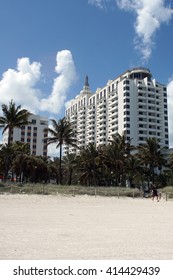 MIAMI, USA - CIRCA MARCH 2016: Massive art deco resort building on South Beach, surrounded by palm trees