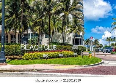 Miami, USA - July 18, 2021: Sign Entrance For Beach Club Apartment Condo Building In Hallandale In Florida With Palm Trees On Sunny Day And Blue Sky