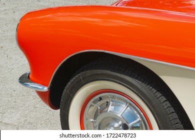 Miami, Year 2019: Chevrolet Corvette Of The 50s. Front Of A Classic American Car. Antiquity In Colors. Orange Classic Car. Headlights, Chrome, Wheels.