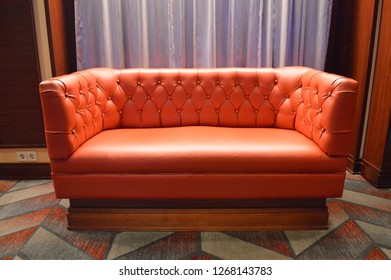 Miami,FL  November 21,2017: Isolated Red Love Seat Sitting In A Private Parlor.