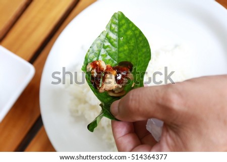 miang kham, mix nut and pork with sweet sauce in green leave, Chiang Mai, Thailand food, Food wrapped in leaves,A nutritious snack in Thailand .miang kham recipe thai 
