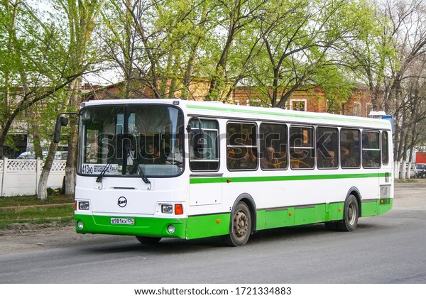 Miass, Russia - May 8, 2010: White and green\
urban bus Liaz 5256 in the city\
street.