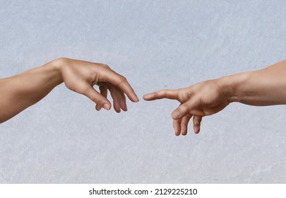 Michelangelo's masterpiece: the creation of Adam, as a photographic imitation. - Shutterstock ID 2129225210