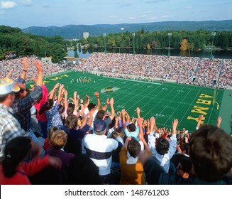 MICHIE STADIUM, NEW YORK - CIRCA 1986: Crowd Doing The Wave At A College Football Game In Michie Stadium, New York