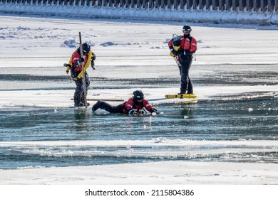 Michigan City, IN USA - January 29, 2022   Coast Guard Rescue Water Training On Frozen Lake Michigan 