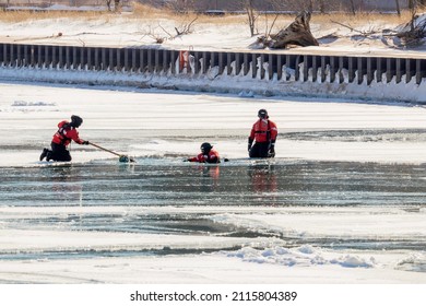 Michigan City, IN USA - January 29, 2022   Coast Guard Rescue Water Training On Frozen Lake Michigan 