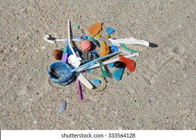 Micro Plastic Fragments In The Sand Of A Beach