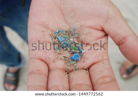 Micro plastic that found from beach lay on people hand.