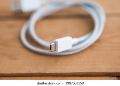 Micro USB Cable (micro USB Chord) On A Wooden Ground, Close Up